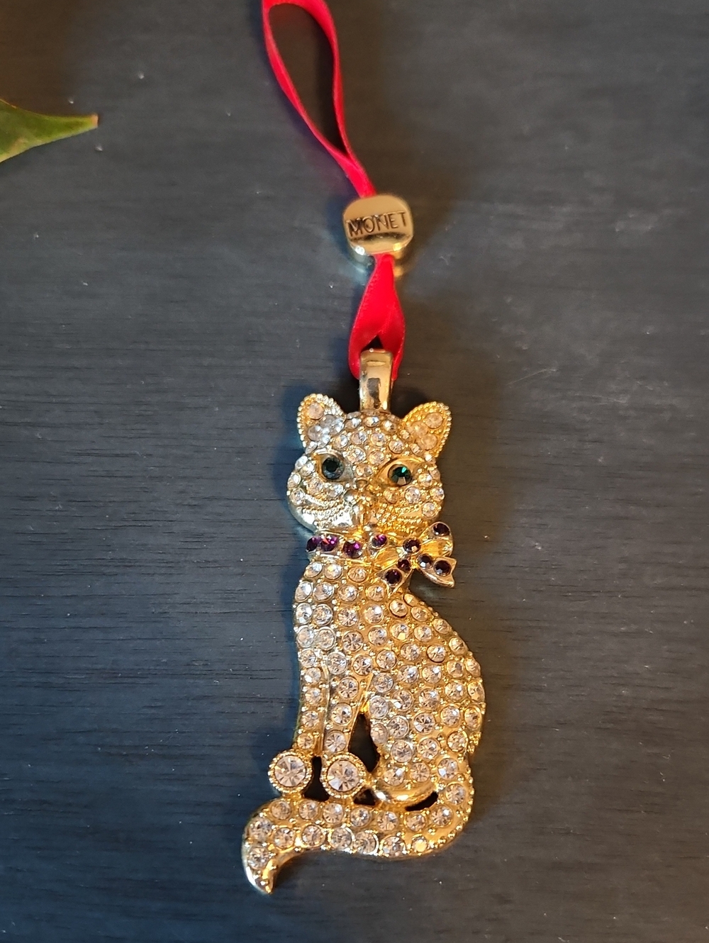 Monet Blingy Gold Cat Ornament with Red Ribbon and Green Eyes